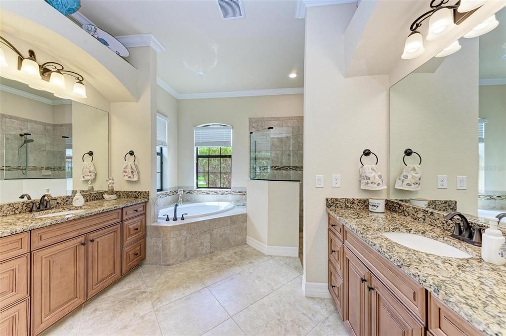 Primary bathroom with double vanities, soaking tub and stand alone shower!
