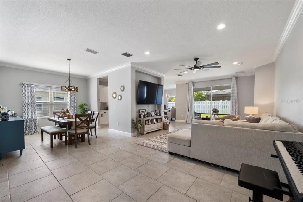 Open Floorplan showing the living room, and dining room with sliding doors opening up to the fenced-in back yard.