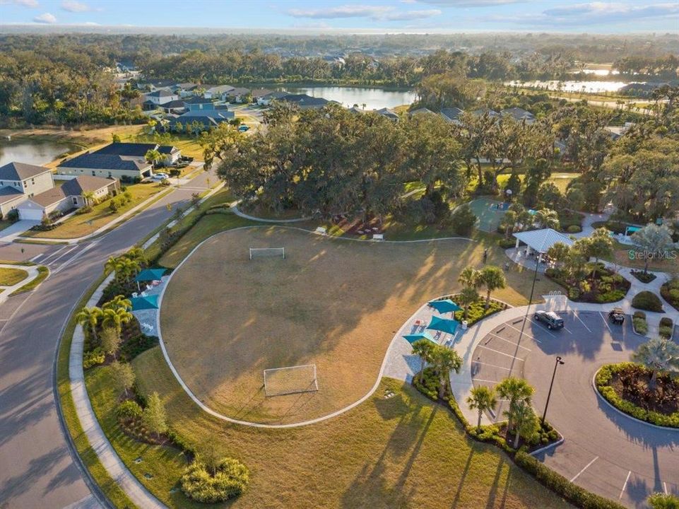 Silverleaf Amenities Center featuring a multipurpose field, dog park, club house, and community pool.