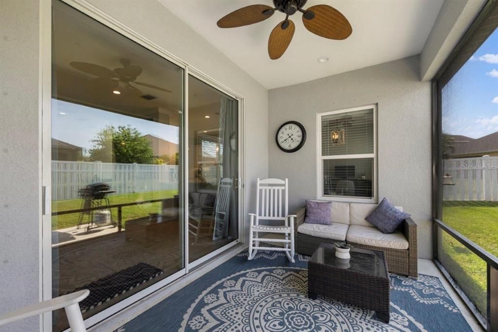 Covered Screened-in Lanai with views of the back yard.