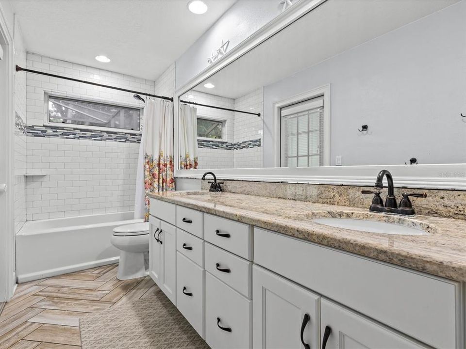 Full Bath with Large Dual Vanity and Pool Access