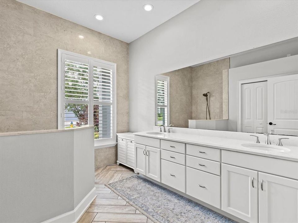 Updated Primary Bath with Dual Granite Vanity, Walk In Shower and Private Water Closet