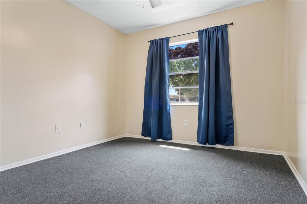 Bedroom 1, black out curtains and ceiling fan