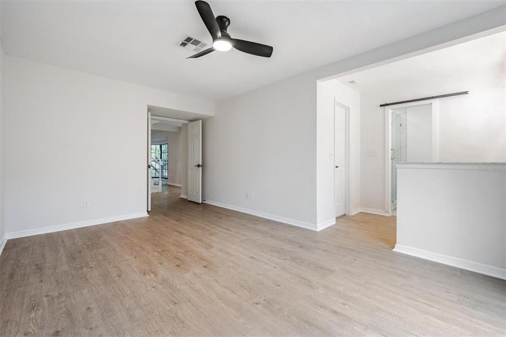 View inside primary bedroom with walk-in closet before the bathroom