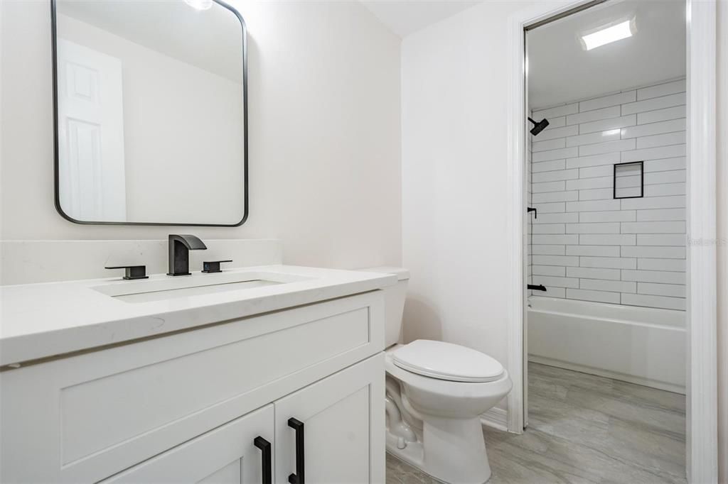 Separate vanity from shower in Jack & Jill. Enters from upstairs hallway