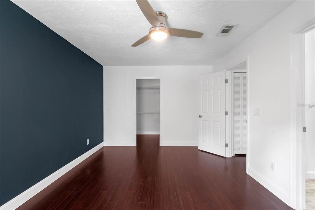 Primary bedroom looking toward walk in closet