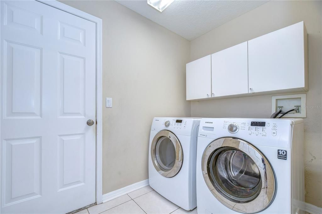 Laundry room with storage cabinets!