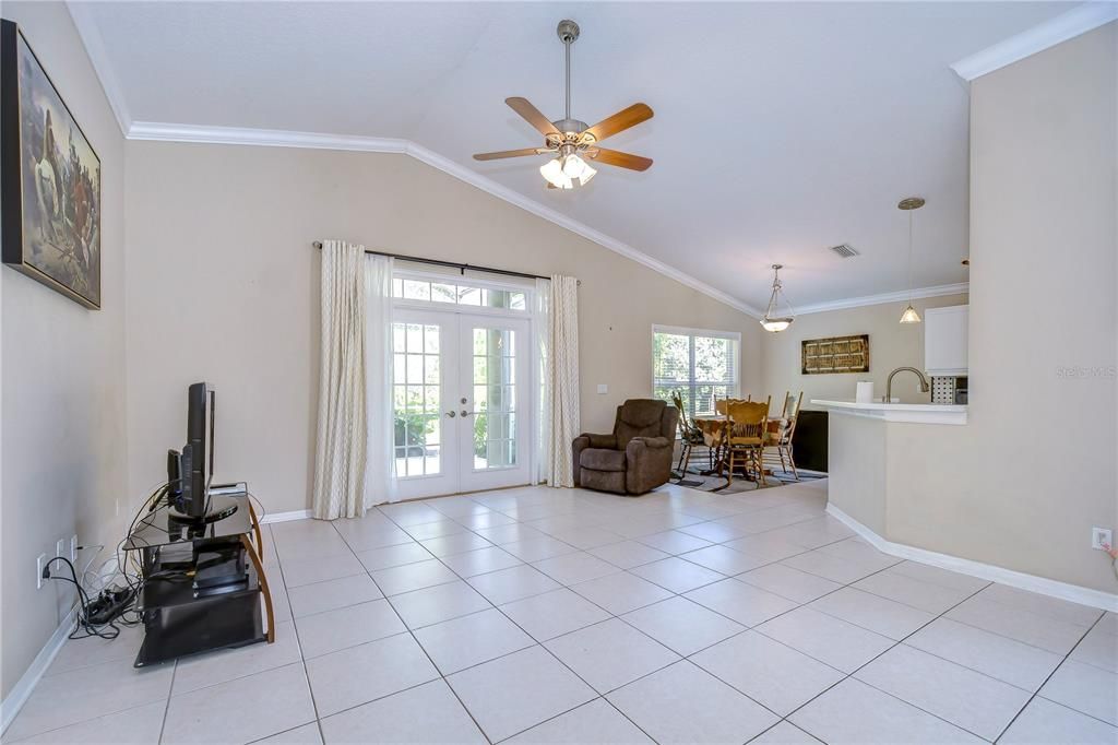 Great room with French doors, crown & vaulted ceiling!