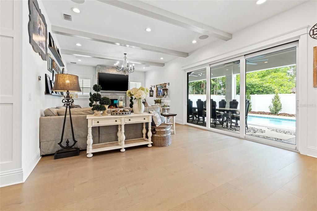 Great room leading to the outdoor space through stackable sliding doors.