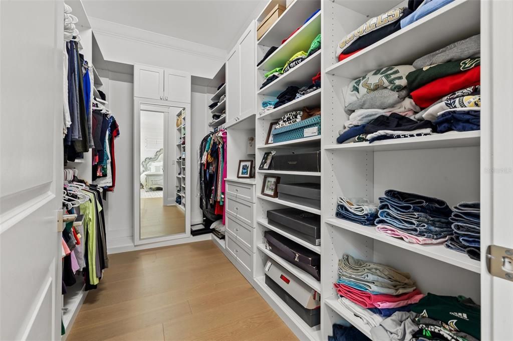 One of two, generous custom walk -in closets