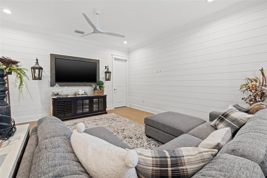 Upstairs Loft/ Bonus Room with beautiful shiplap decorative walls.