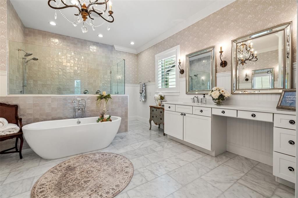 Dreamy Spa-Oasis- with honed marble floors, a generous walk in shower and separate soaking tub.  Beautiful designer wallpaper, light fixtures and sconces!