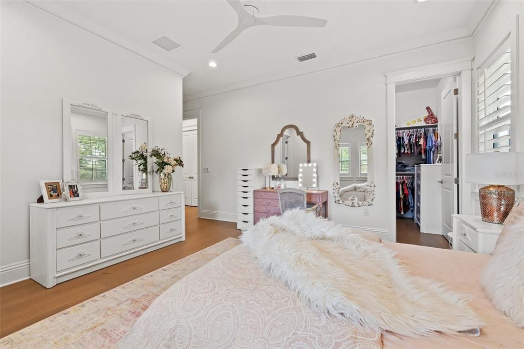 Upstairs bedroom with ensuite bath and oversized custom walk in closet