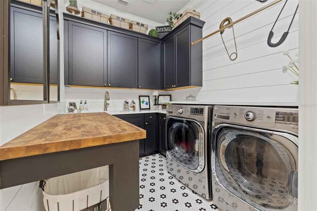 Upstairs Laundry Room with built in folding table. Washer/ Dryer convey with the home!