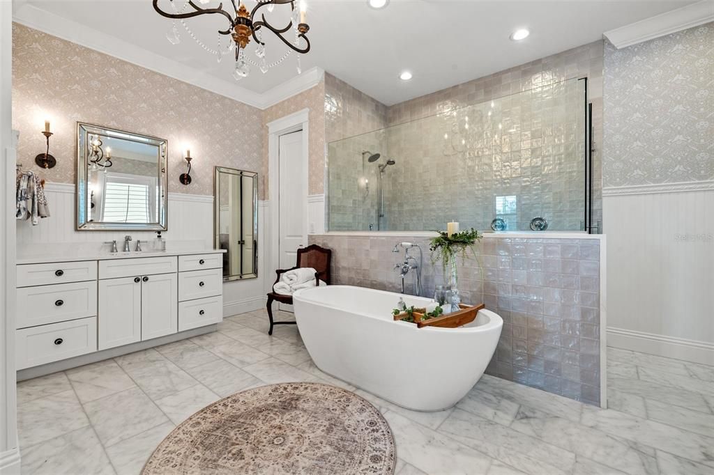 Dreamy Spa-Oasis- with honed marble floors, a generous walk in shower and separate soaking tub.  Beautiful designer wallpaper, light fixtures and sconces!