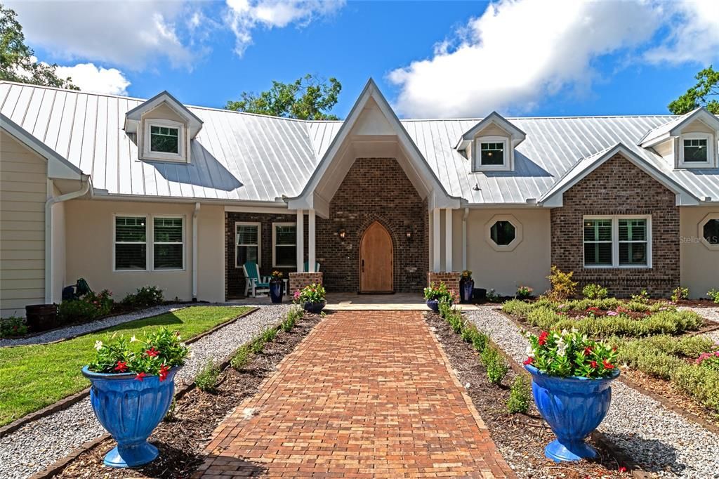 Paved walkway surrounded by flower beds