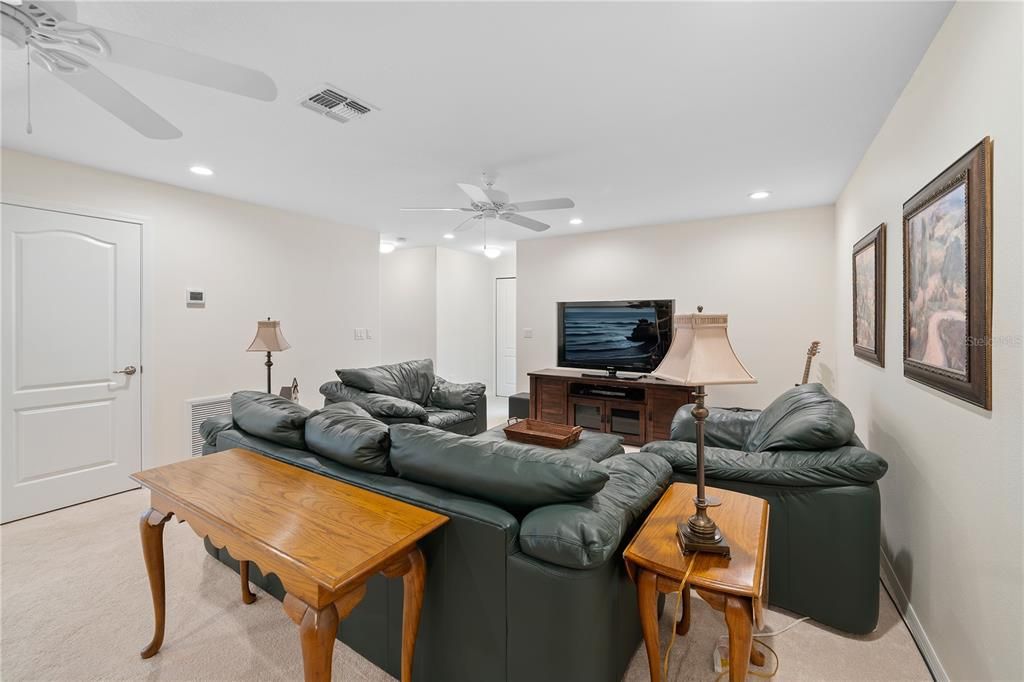 Bonus room with view of opening leading to the secondary bedrooms