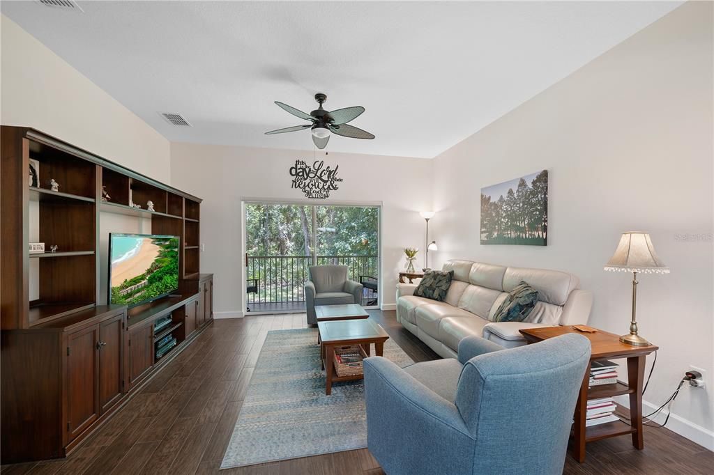 Great room with neutral colors and wood-look porcelain tile floors