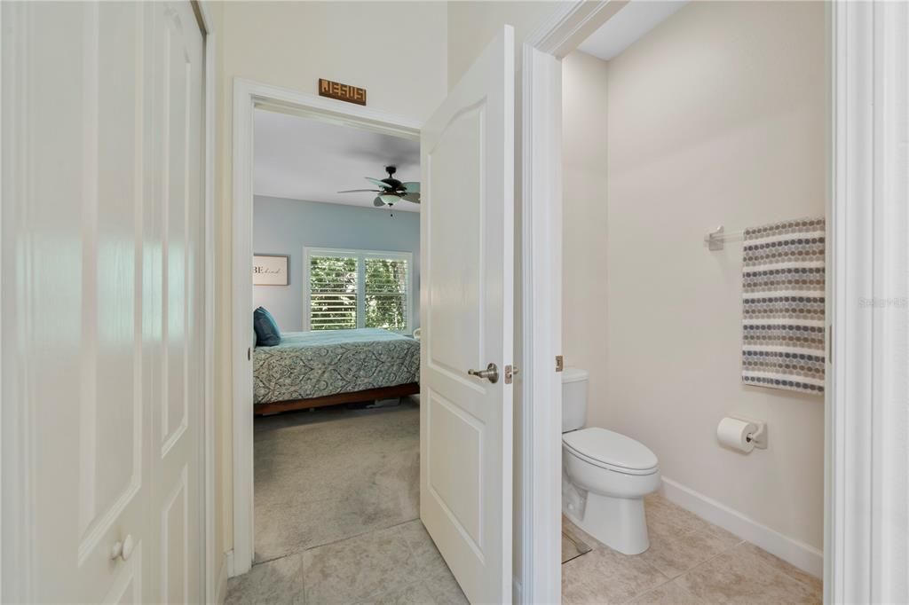 View into master bath from the master bedroom that includes a water closet