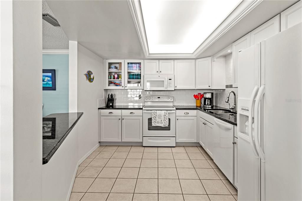 Well equipped Kitchen features breakfast bar