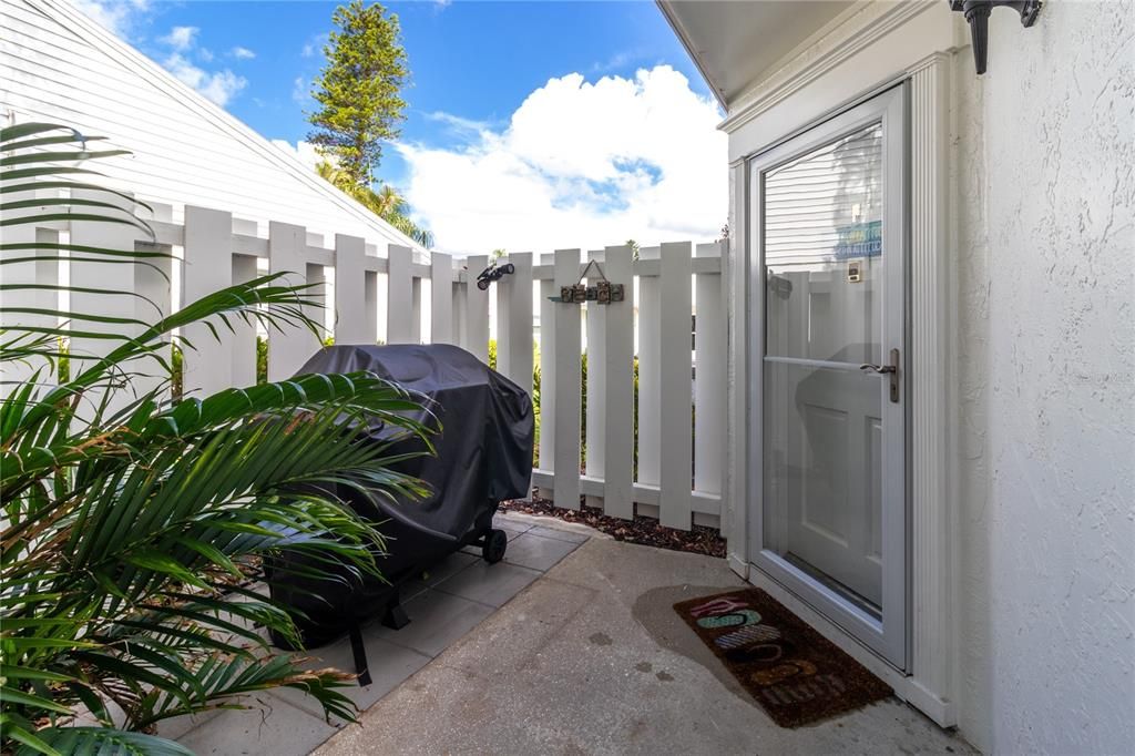 Grilling area with privacy fence and solar light with motion sensor.