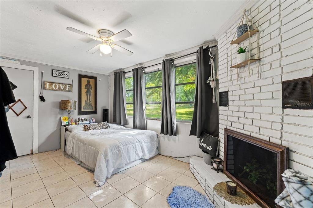 Bedroom three with wood burning fireplace