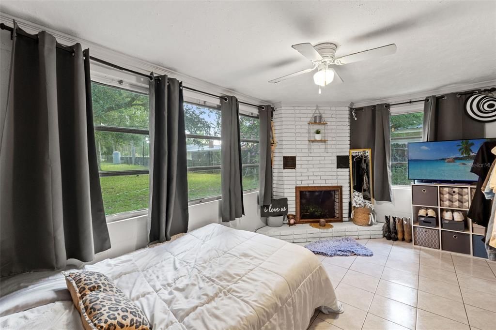 Bedroom three with wood burning fireplace