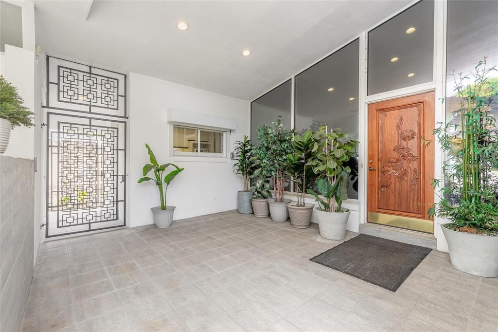 Wooden carved door adds character to this one-of-a-kind home