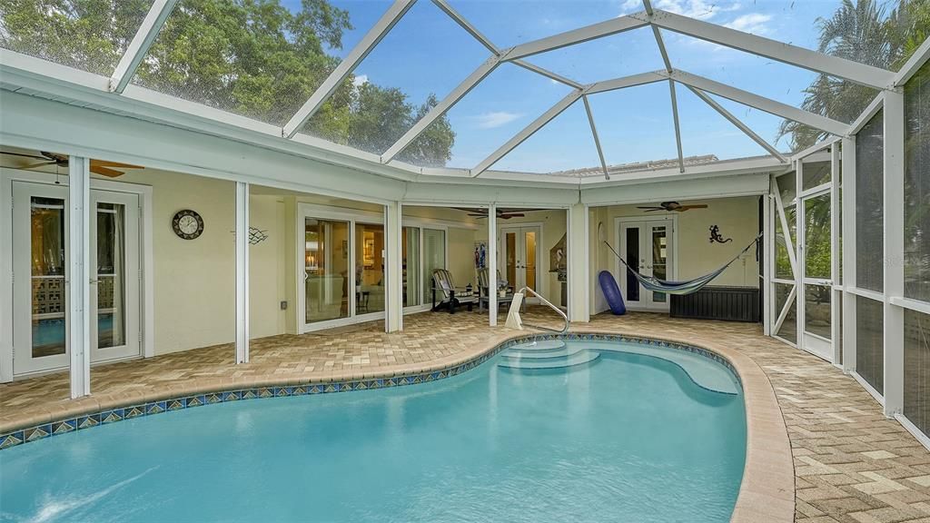 THE WHOLE HOME OPENS UP TO THE COVERED PATIO & POOL