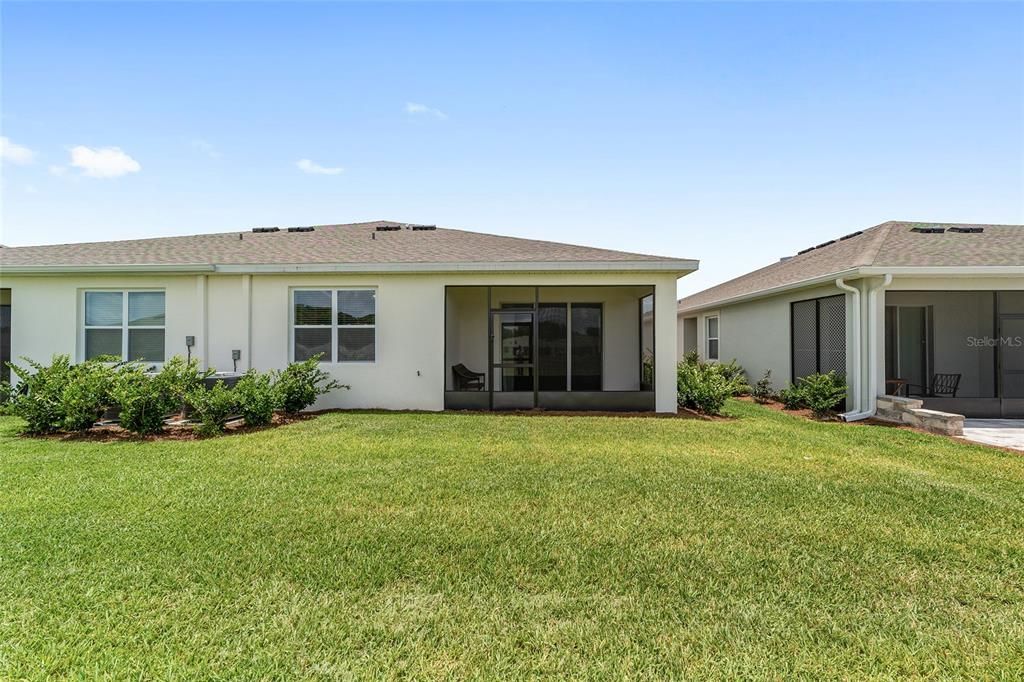 2 Car Garage, Paver Driveway and Lush Landscaping