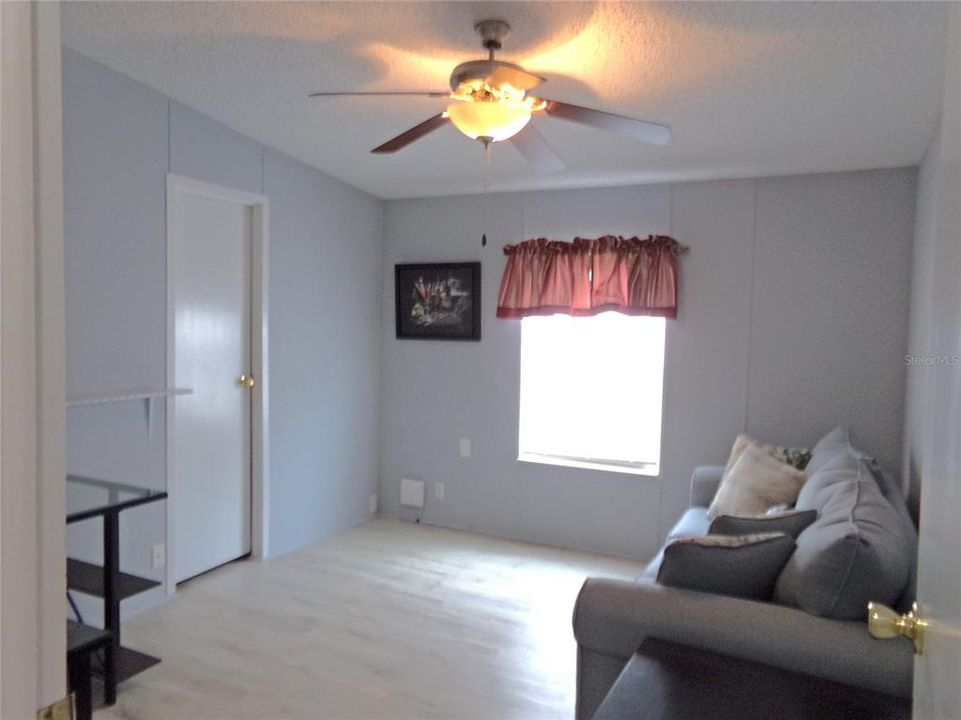 third bedroom with walk in closet