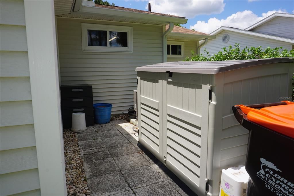 STORAGE AREA ON SIDE OF HOUSE IN BACK