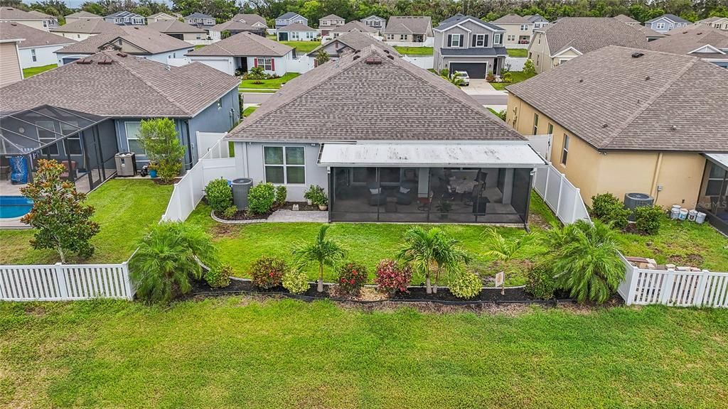 BACK OF HOUSE WITH BEAUTIFULLY MAINTAINED YARD