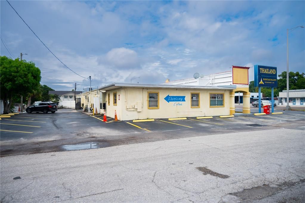 Side view of restaurant and side & rear parking