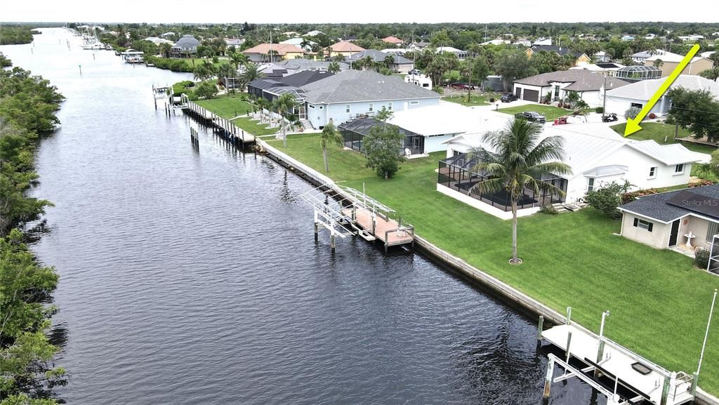 Aerial view of home and waterfront