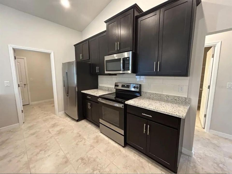 Kitchen with doorway to laundry room and garage