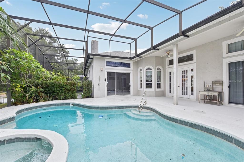 BEAUTIFUL POOL AREA of approximately 1500 of space under the OVERSIZED and CUSTOM SCREEN ENCLOSURE. The POOL AREA was CUSTOMIZED for ULTIMATE PRIVACY, TRANQUILITY and COMFORT!