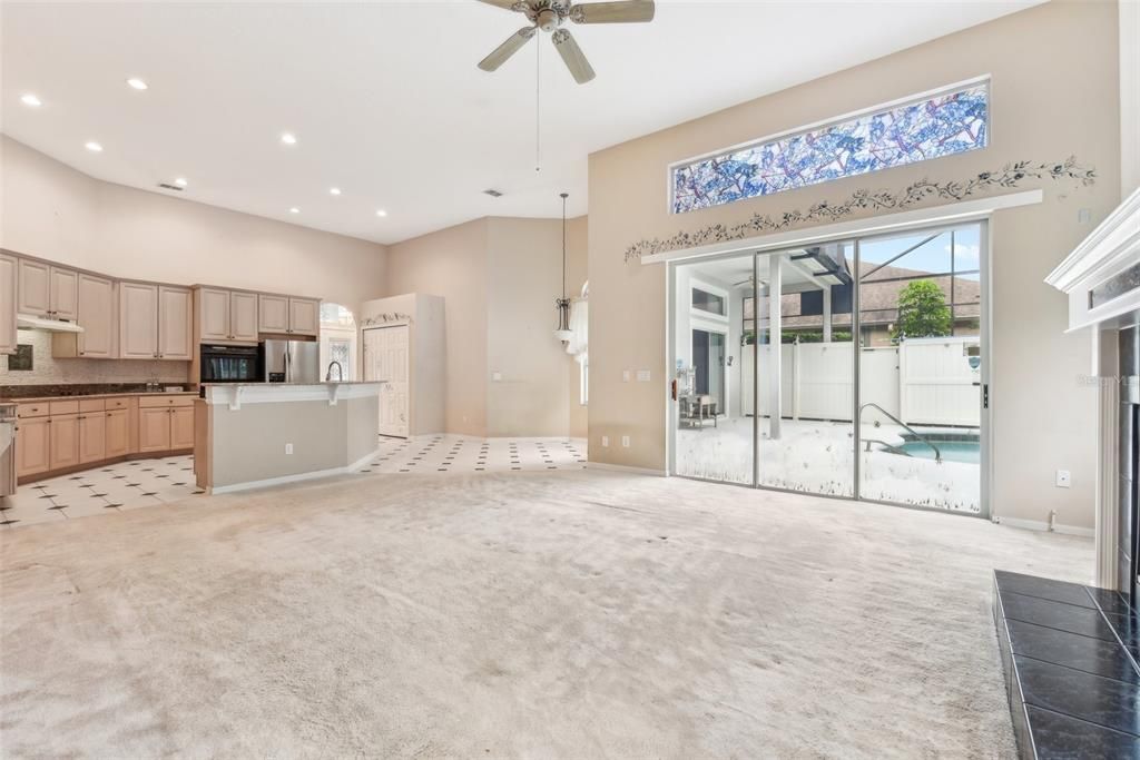 Main Family Room with SO MUCH NATURAL LIGHT and LARGE KITCHEN. 13 FT CEILINGS!