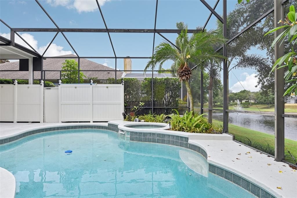 BEAUTIFUL POOL AREA of approximately 1500 of space under the OVERSIZED and CUSTOM SCREEN ENCLOSURE. The POOL AREA was CUSTOMIZED for ULTIMATE PRIVACY, TRANQUILITY and COMFORT!