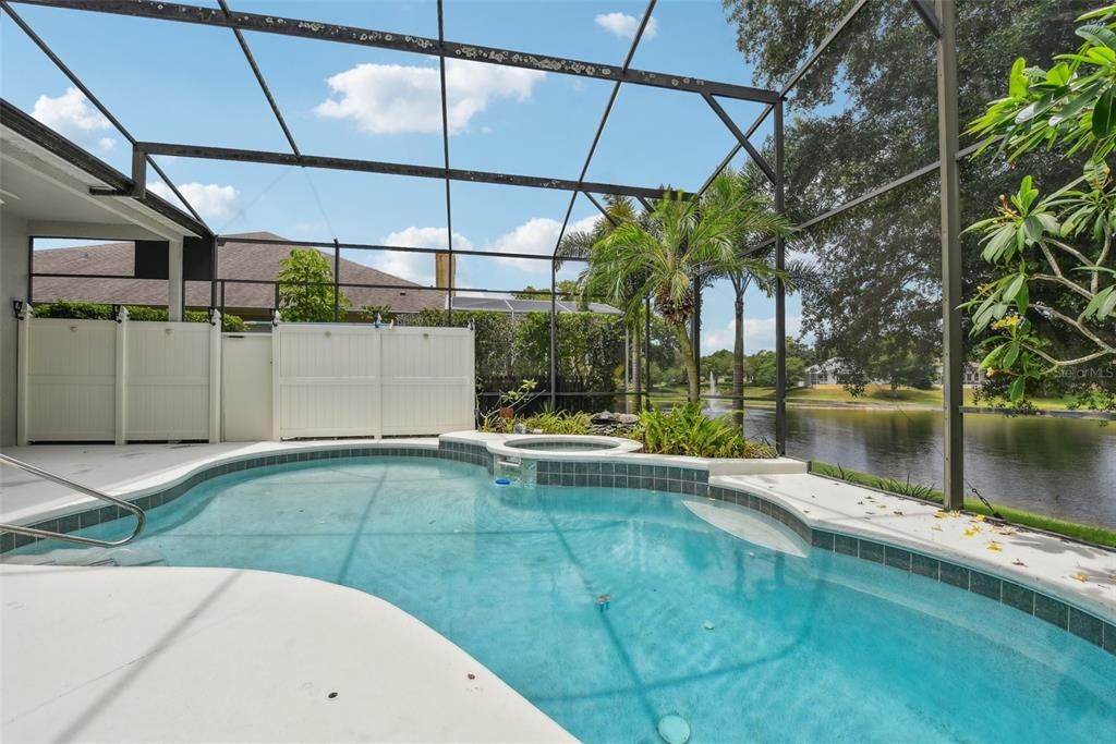 BEAUTIFUL POOL AREA of approximately 1500 of space under the OVERSIZED and CUSTOM SCREEN ENCLOSURE. The POOL AREA was CUSTOMIZED for ULTIMATE PRIVACY, TRANQUILITY and COMFORT!