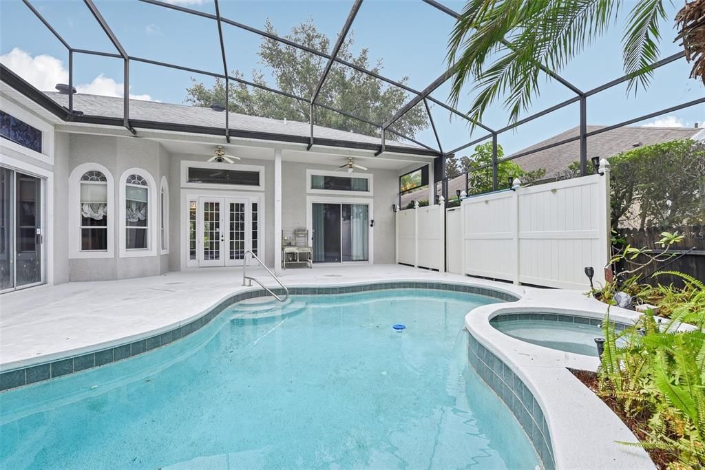 BEAUTIFUL POOL AREA of approximately 1500 of space under the OVERSIZED and CUSTOM SCREEN ENCLOSURE. The POOL AREA was CUSTOMIZED for ULTIMATE PRIVACY, TRANQUILITY and COMFORT!