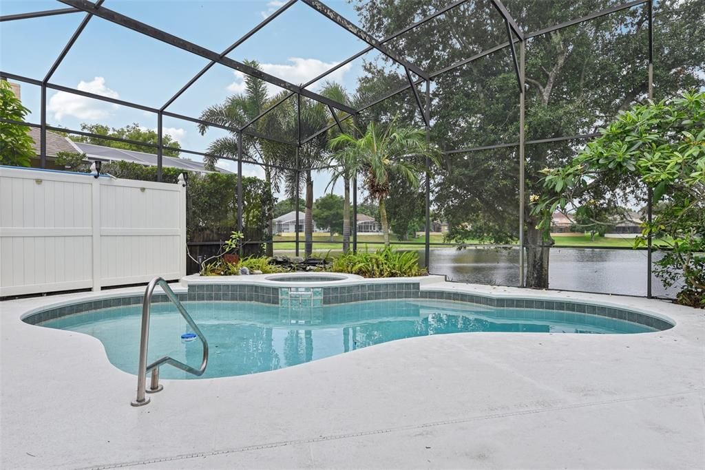 BEAUTIFUL POOL AREA of approximately 1500 of space under the OVERSIZED and CUSTOM SCREEN ENCLOSURE. The POOL AREA was CUSTOMIZED for ULTIMATE PRIVACY, TRANQUILITY and COMFORT!