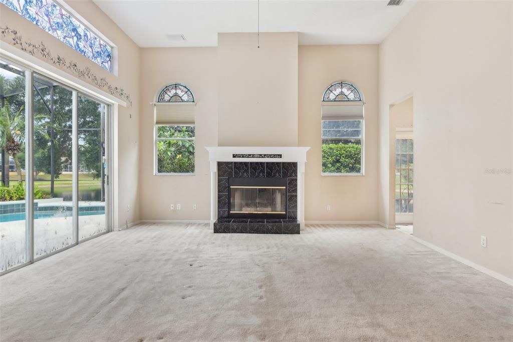 Main Family Room with SO MUCH NATURAL LIGHT. 13 FT CEILINGS!