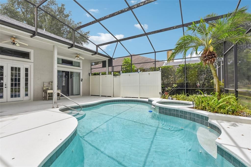 BEAUTIFUL POOL AREA of approximately 1500 of space under the OVERSIZED and CUSTOM SCREEN ENCLOSURE. The POOL AREA was CUSTOMIZED for ULTIMATE PRIVACY, TRANQUILITY and COMFORT!