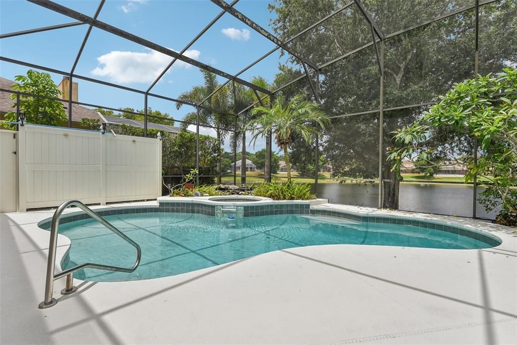BEAUTIFUL POOL AREA of approximately 1500 of space under the OVERSIZED and CUSTOM SCREEN ENCLOSURE. The POOL AREA was CUSTOMIZED for ULTIMATE PRIVACY, TRANQUILITY and COMFORT!