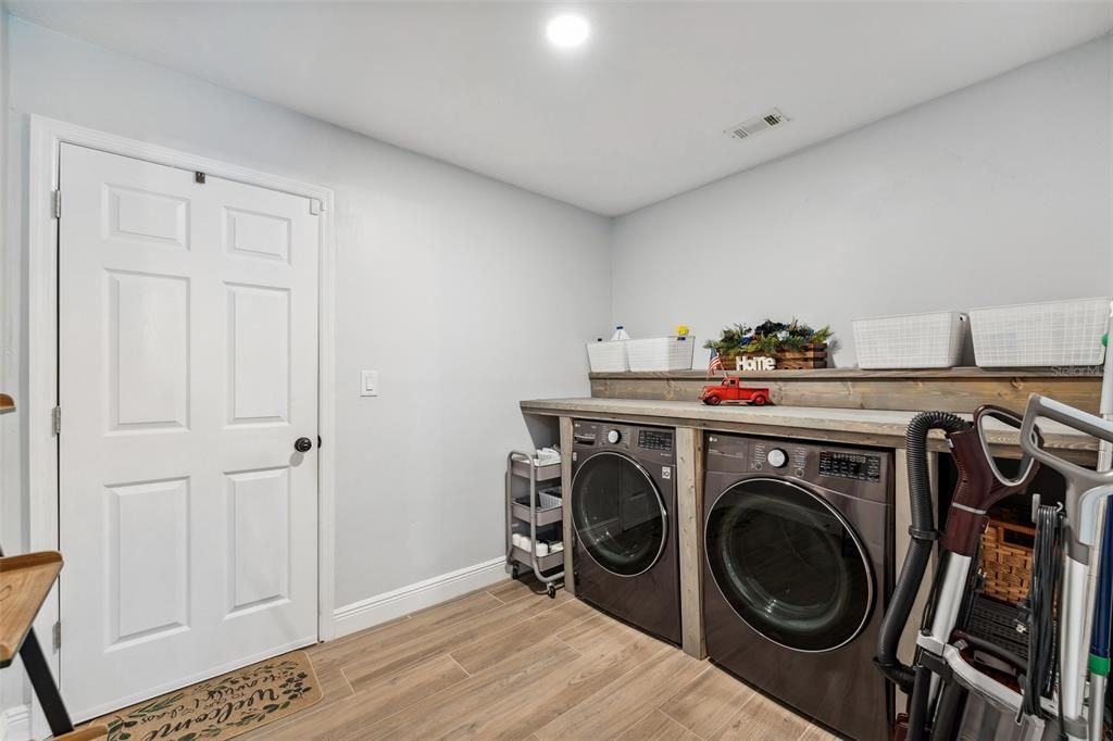 Large laundry room with washer and dryer