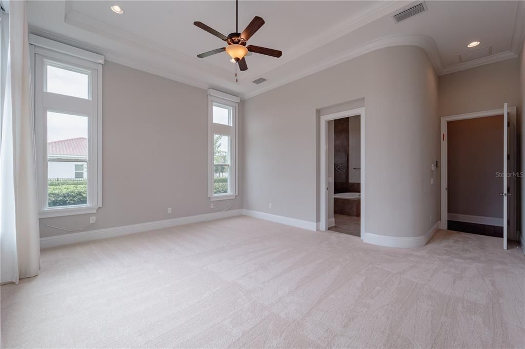 The wall in the master bedroom is curved.