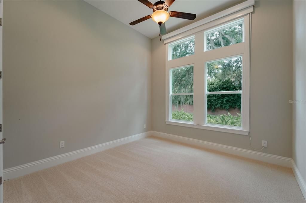 Bedroom 3 has a motorized window treatments and new carpets.