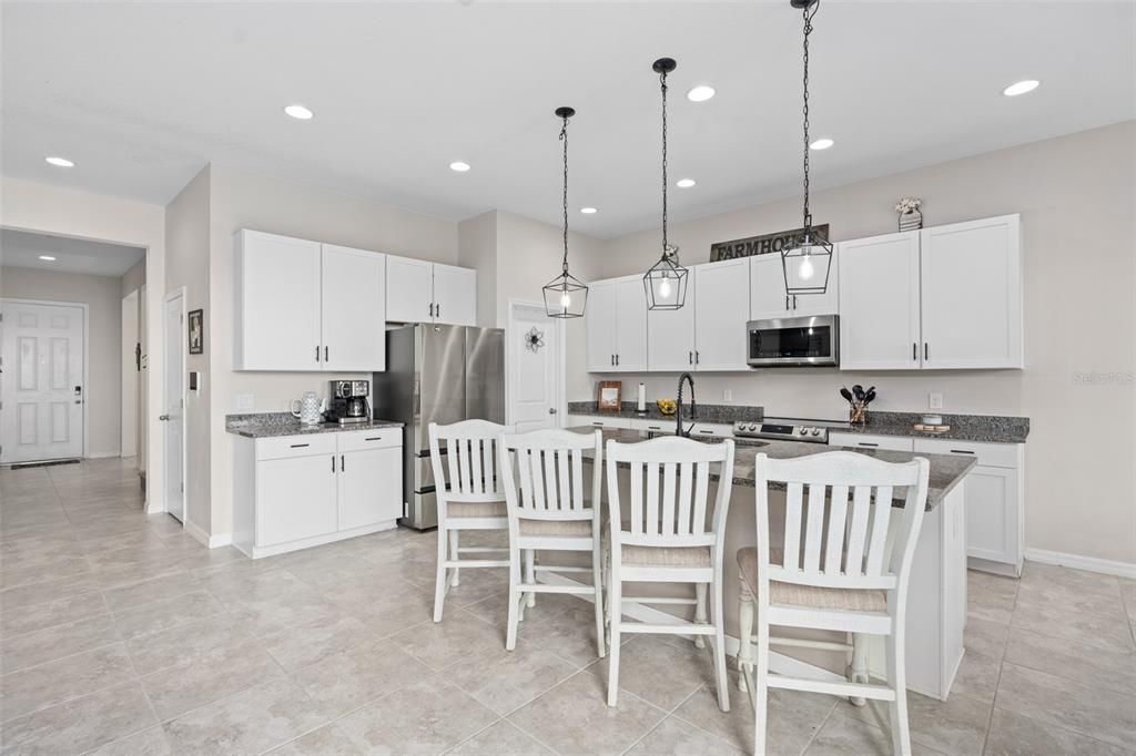 kitchen also boasts custom pendant lighting