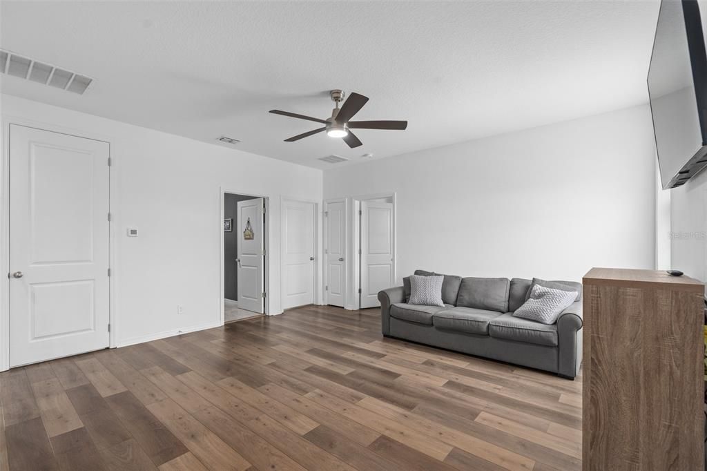 Look at this enormous loft with luxury vinyl plank! This runs up the whole upstairs.. and even down the stairs as well!